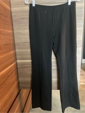 Clara Sun Woo Black Straight leg pull on pant with cool slit bottom front.
